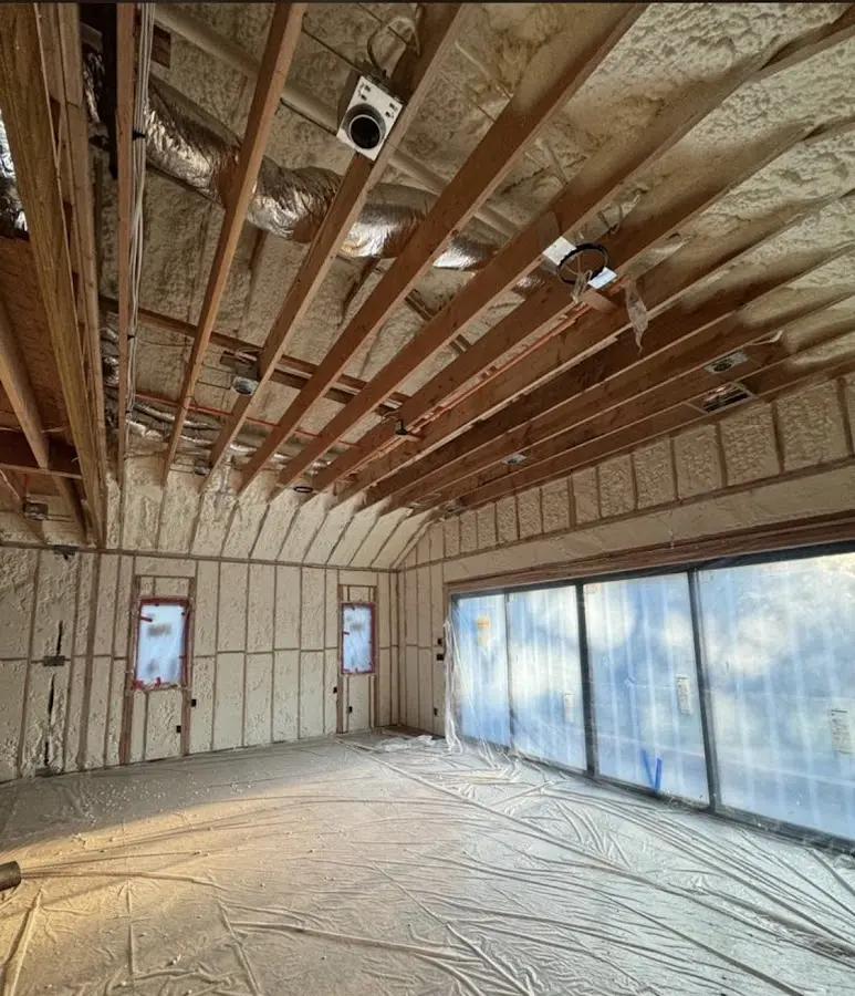 Interior walls and ceiling insulated with spray foam during new construction in Dartmouth